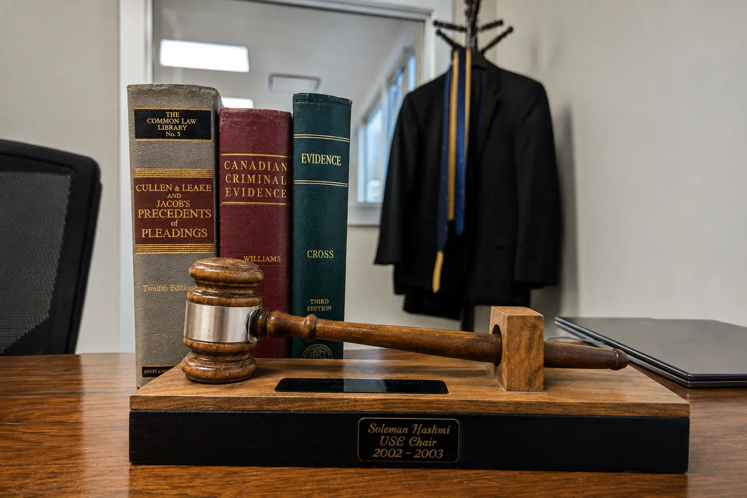 Soleman Hashmi's USC Chair gavel award beside Canadian law texts